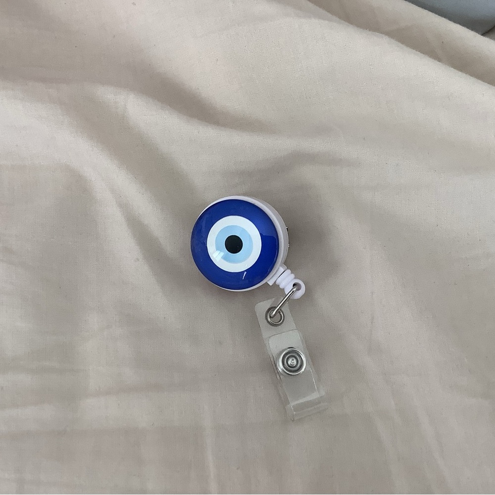 Evil eye badge reel